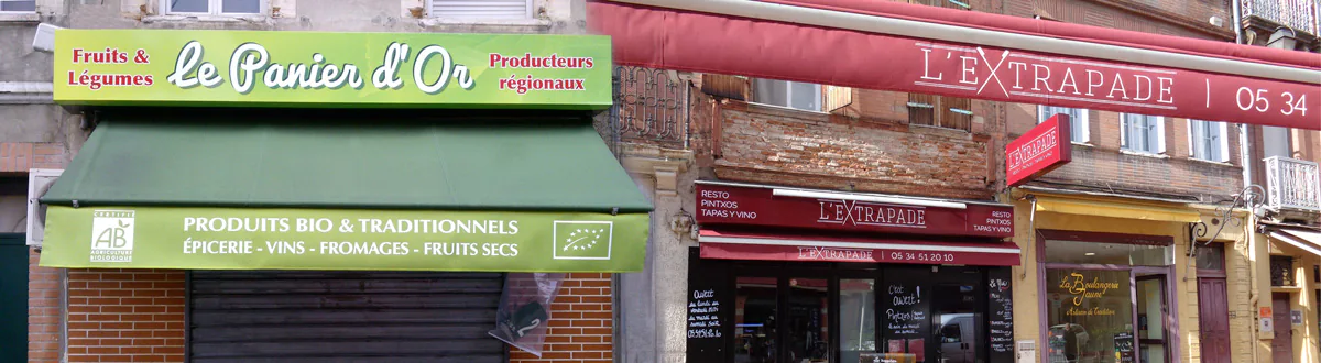 Logos et lettrages peints directement sur le lambrequin de stores bannes à l'aide de pochoirs adhésifs